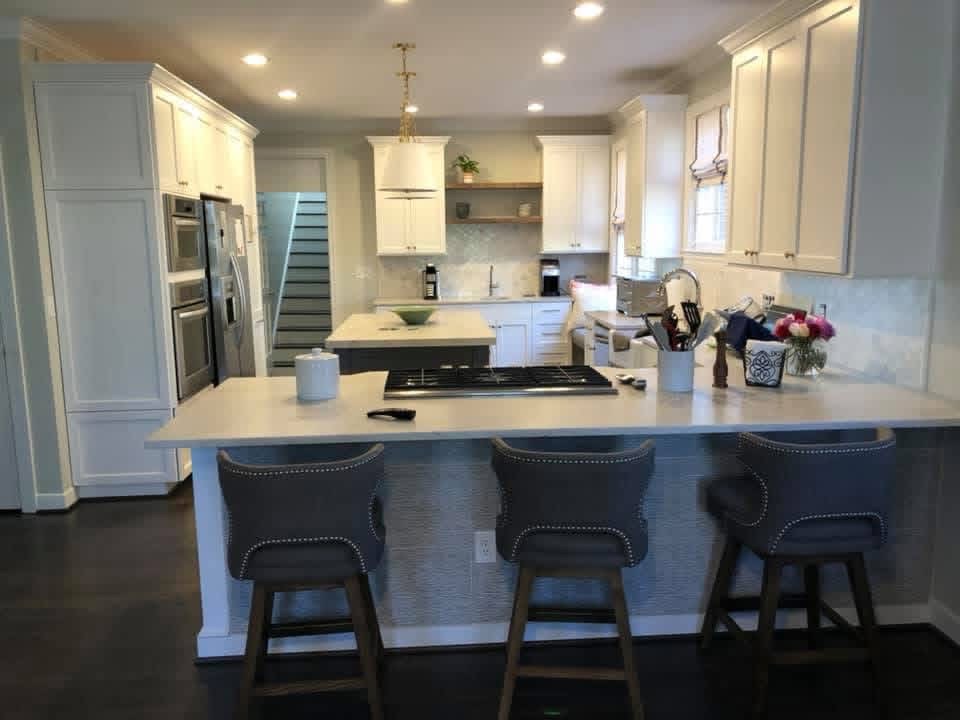 Finished white kitchen cabinets refinished by Carlton Custom Painting